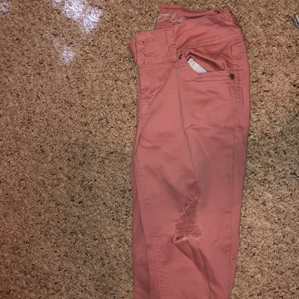 Pink ripped jeans